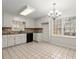 Spacious kitchen with white cabinetry, tile backsplash, and stainless steel appliances at 3284 Devaughn Ne Dr, Marietta, GA 30066