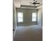 Spacious bedroom featuring a ceiling fan and two sunny windows at 200 Brookwood Xing, Douglasville, GA 30134