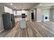Open concept kitchen with white cabinets, stainless steel appliances, and granite countertops at 200 Brookwood Xing, Douglasville, GA 30134