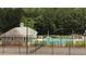 Community tennis court and pool area offers outdoor recreation at 200 Brookwood Xing, Douglasville, GA 30134