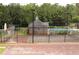 Community tennis and basketball courts, with a pool in the background at 200 Brookwood Xing, Douglasville, GA 30134