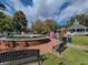 A scenic town square featuring a gazebo, benches, and a decorative fountain, inviting relaxation and community gathering at 2008 Cottonwood Ln, Woodstock, GA 30188