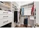 Organized walk-in closet featuring built-in shelving, drawers, and hanging racks for clothing storage at 2008 Cottonwood Ln, Woodstock, GA 30188