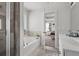 Elegant bathroom featuring a soaking tub, walk-in shower, dual sinks, and stylish finishes, perfect for relaxation at 242 Crestbrook Ln, Dallas, GA 30157