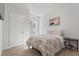 Comfortable bedroom with a neutral color palette, soft bedding, and a serene atmosphere for restful nights at 242 Crestbrook Ln, Dallas, GA 30157
