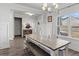 Bright dining room with white trim, wooden table and bench seating at 242 Crestbrook Ln, Dallas, GA 30157