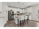 Modern kitchen with stainless steel appliances, granite countertops, and a large center island at 242 Crestbrook Ln, Dallas, GA 30157