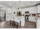 Modern kitchen with stainless steel appliances, granite countertops, and a large center island at 242 Crestbrook Ln, Dallas, GA 30157