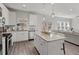 Open-concept kitchen featuring stainless appliances, granite counters, and seamless flow to the living area at 242 Crestbrook Ln, Dallas, GA 30157