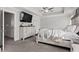 Cozy main bedroom featuring a ceiling fan, dresser, and modern design at 242 Crestbrook Ln, Dallas, GA 30157