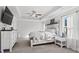 Serene main bedroom featuring a tray ceiling and stylish furnishings at 242 Crestbrook Ln, Dallas, GA 30157