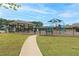 Community playground with slides, swings, and climbing structures, surrounded by green space at 242 Crestbrook Ln, Dallas, GA 30157