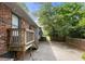 View of backyard patio area with access to the house and stairs at 3319 Colony Dr, Conyers, GA 30013