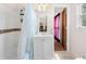 Clean bathroom featuring a shower/tub combination, white vanity, and updated fixtures at 3319 Colony Dr, Conyers, GA 30013