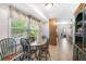 Sunny dining area with large windows overlooking landscaped yard at 3319 Colony Dr, Conyers, GA 30013