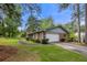 Brick house with attached garage, and green grass surrounding at 3319 Colony Dr, Conyers, GA 30013