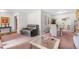 A living room featuring cozy seating, decorative artwork, and a welcoming dining area at 3319 Colony Dr, Conyers, GA 30013