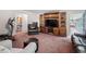 Comfortable living room featuring plush seating and a rustic entertainment center at 3319 Colony Dr, Conyers, GA 30013