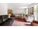 Spacious living room featuring multiple seating areas and neutral décor at 3319 Colony Dr, Conyers, GA 30013
