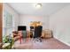 Bright home office with natural light, desk, and neutral walls at 3319 Colony Dr, Conyers, GA 30013