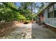 Brick patio area with privacy wall, ideal for outdoor entertaining at 3319 Colony Dr, Conyers, GA 30013