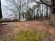 Expansive backyard with mature trees and room to add your own personal touches at 3450 Estes Dr, Atlanta, GA 30349