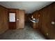 Functional kitchen space with wood paneling, sink, and door to the outside, ready for customization at 3450 Estes Dr, Atlanta, GA 30349