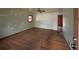 Spacious living room featuring hardwood floors, natural light, and a ceiling fan for added comfort at 3450 Estes Dr, Atlanta, GA 30349