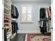 Spacious walk-in closet with custom shelving and a window at 200 Edinburgh Ln, Woodstock, GA 30188