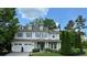 Beautiful two-story home with dormer windows, a well-maintained lawn, and an attached two-car garage at 200 Edinburgh Ln, Woodstock, GA 30188