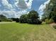 Home with a large front yard, mature trees, and shrubs at 200 Edinburgh Ln, Woodstock, GA 30188