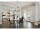 Bright kitchen and breakfast area with white cabinets, stainless appliances, and a table near the door to outside at 200 Edinburgh Ln, Woodstock, GA 30188