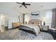 Beautiful main bedroom featuring lots of light, hardwood floors, and a cozy seating area at 200 Edinburgh Ln, Woodstock, GA 30188
