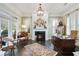 Inviting home office with a fireplace, a large desk, and windows providing natural light at 200 Edinburgh Ln, Woodstock, GA 30188