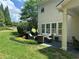 Charming patio with outdoor seating, a grill, and a well-maintained lawn at 200 Edinburgh Ln, Woodstock, GA 30188