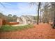 Charming backyard with a screened-in porch, wooded perimeter and a fenced parking pad at 1105 Fountain Head Ln, Lawrenceville, GA 30043