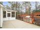 Outdoor living space with screened-in porch, custom grill station and a landscaped yard at 1105 Fountain Head Ln, Lawrenceville, GA 30043