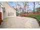 Spacious backyard with a large patio area, perfect for outdoor activities and relaxation at 1105 Fountain Head Ln, Lawrenceville, GA 30043