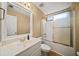 Bathroom with single vanity, frameless mirror, and sliding glass shower doors at 1105 Fountain Head Ln, Lawrenceville, GA 30043