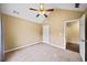 Bedroom featuring vaulted ceiling, ceiling fan, and doorway with view of hardwood floors at 1105 Fountain Head Ln, Lawrenceville, GA 30043