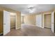 Spacious bedroom with carpet, ceiling fan, and walk-in closets at 1105 Fountain Head Ln, Lawrenceville, GA 30043