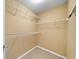Walk-in closet with white wire shelving and neutral carpet at 1105 Fountain Head Ln, Lawrenceville, GA 30043
