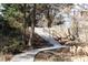 Scenic concrete path with stairs winding through lush foliage, inviting residents to explore the community at 1105 Fountain Head Ln, Lawrenceville, GA 30043