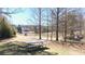 Picturesque community pond with a picnic table overlooking the water and surrounding greenery at 1105 Fountain Head Ln, Lawrenceville, GA 30043