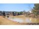 Community pond offering serene views, surrounded by trees, and enhanced by natural beauty at 1105 Fountain Head Ln, Lawrenceville, GA 30043