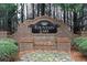 Elegant brick entrance sign for Fountain Lake, set among lush greenery and landscaping at 1105 Fountain Head Ln, Lawrenceville, GA 30043