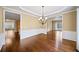 Spacious dining room featuring hardwood floors, stylish trim, and a modern chandelier at 1105 Fountain Head Ln, Lawrenceville, GA 30043