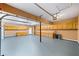Large garage with storage cabinets and an overhead door at 1105 Fountain Head Ln, Lawrenceville, GA 30043