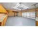 Spacious garage featuring ample storage cabinets and a clean, epoxy-coated floor at 1105 Fountain Head Ln, Lawrenceville, GA 30043