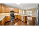 Well-equipped kitchen with stainless steel appliances, granite counters, and breakfast bar at 1105 Fountain Head Ln, Lawrenceville, GA 30043